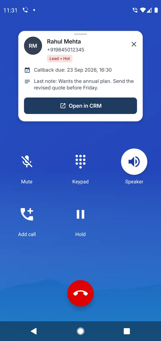 An Android in-call screen with the Call Manager caller card dragged to the top, clear of the Mute, Keypad and Speaker buttons, showing Rahul Mehta, his number, a Lead and Hot badge, a callback due 23 Sep 2026 at 16:30, the last note and an Open in CRM button